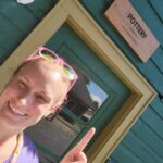 vanessa pointing to pottery sign