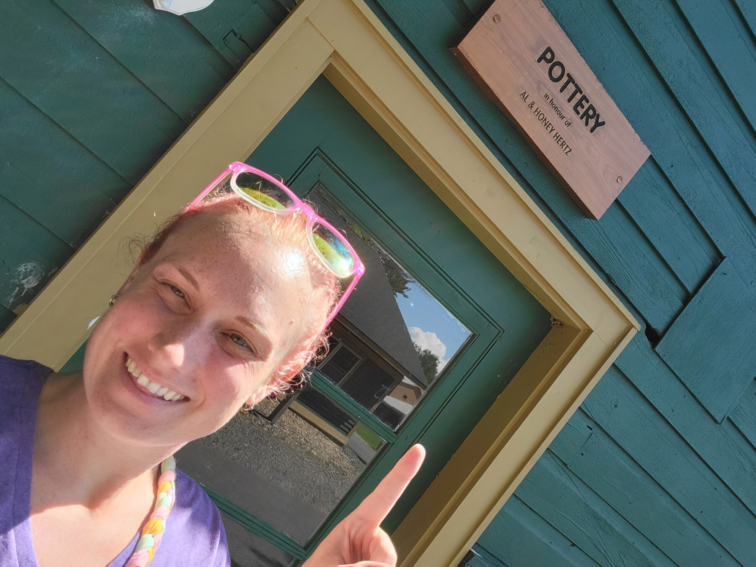 vanessa pointing to pottery sign