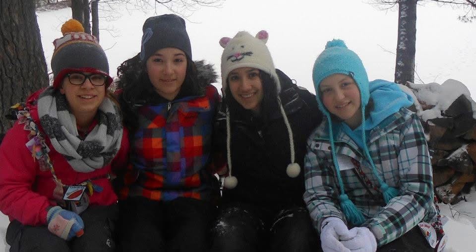 maram and campers outside on a winter day