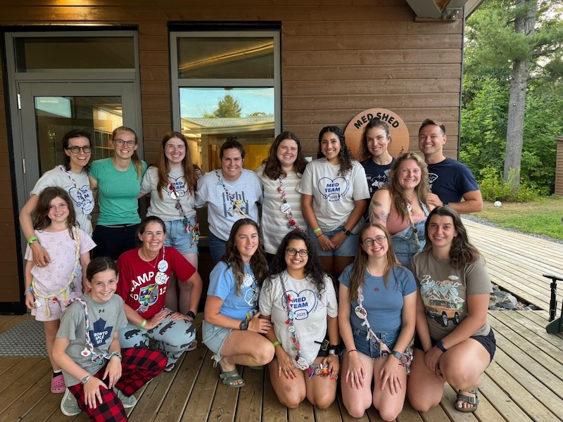 maram with nurses and campers in front of the med shed