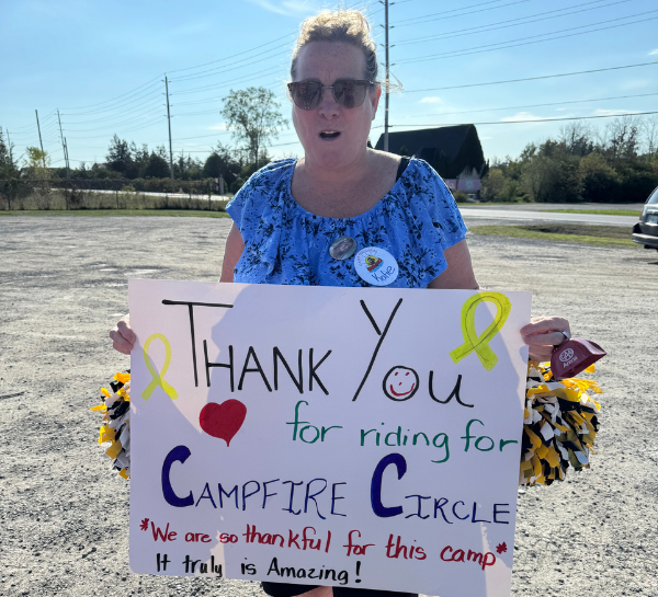 camper mom katie with her support sign