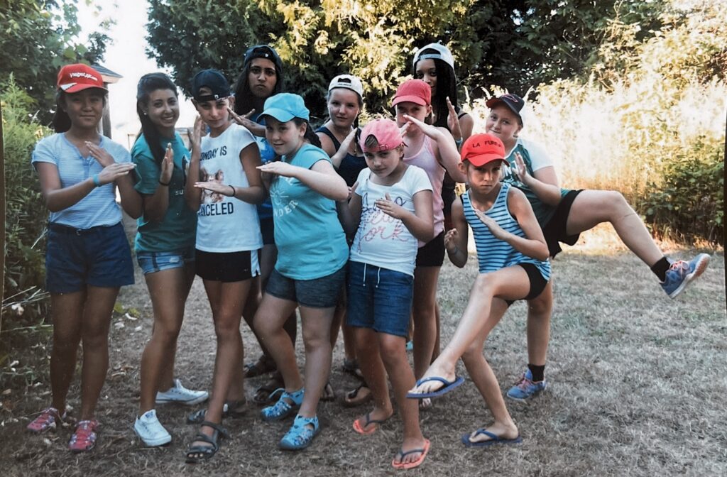 kiran at camp with other campers when younger