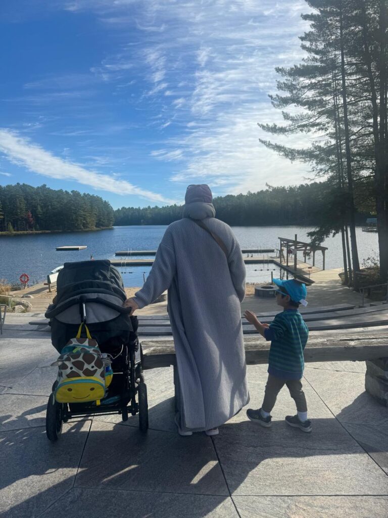 nidra and kids looking at the lake at camp