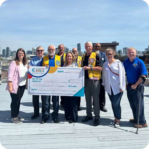 lions clubs presenting a cheque on campfire circle rooftop