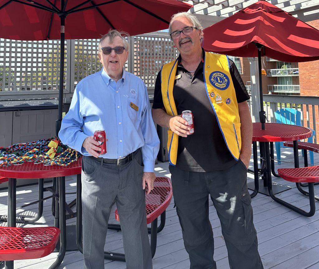 lions club members on rooftop on a sunny day