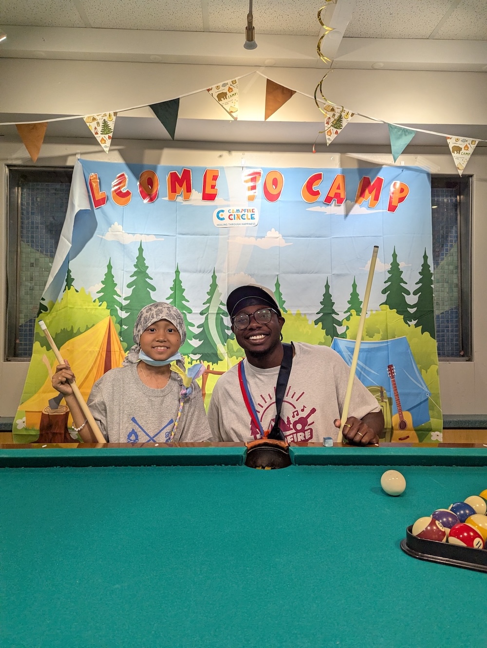 kursten with campfire circle staff at the billiards table