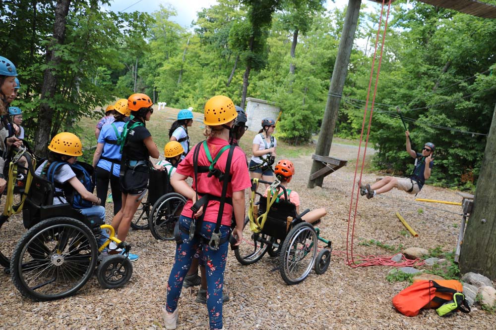 adventure course training with campers in the forest
