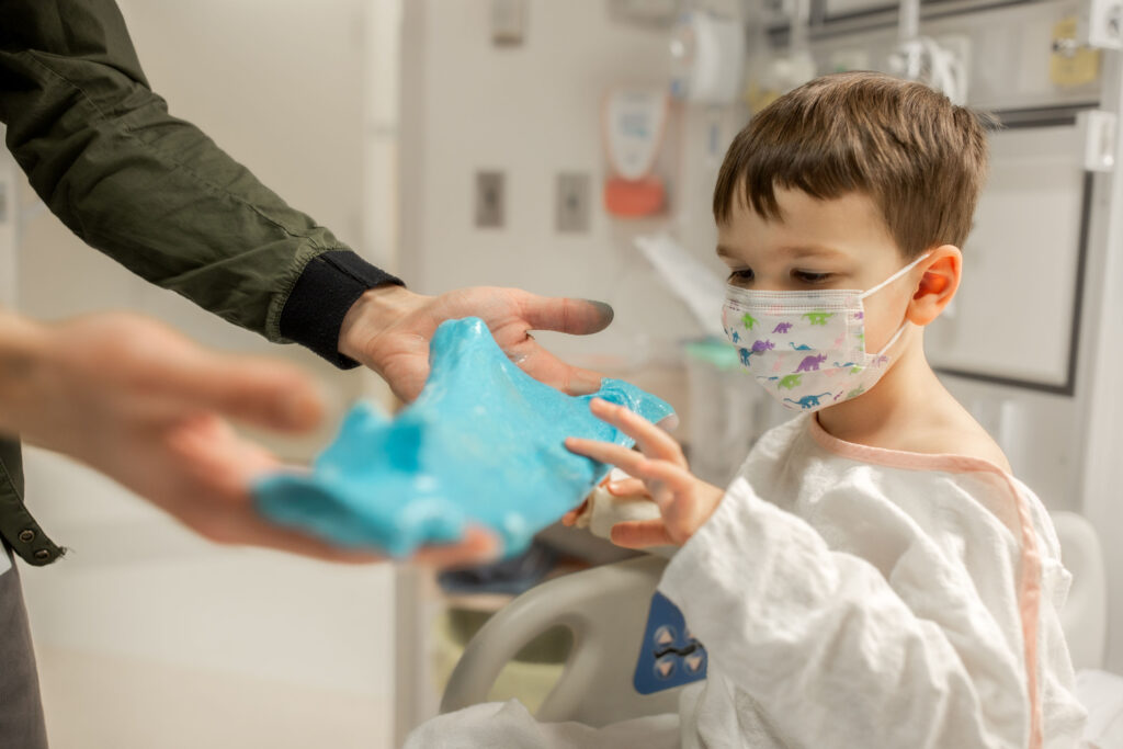 benjamin playing with slime in the hospital