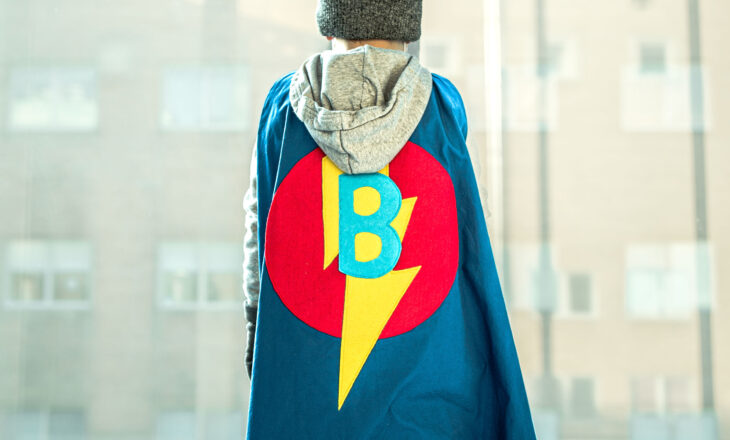 benjamin wearing his superhero cape