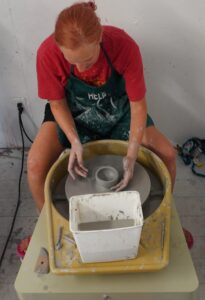 vanessa at camp with pottery wheel