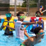 campers in the pool at camp