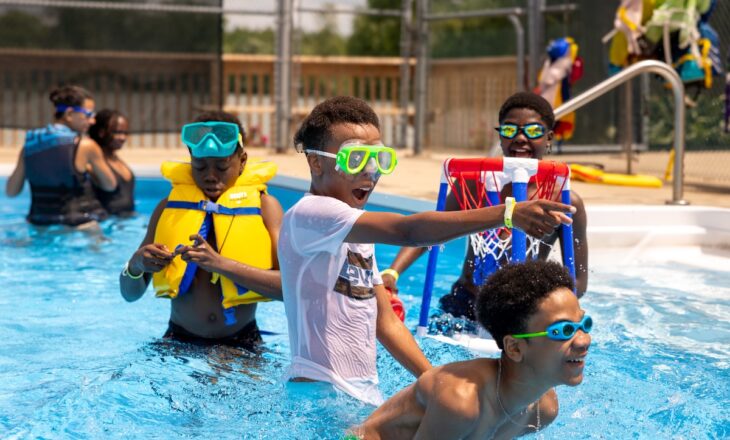campers in the pool at camp
