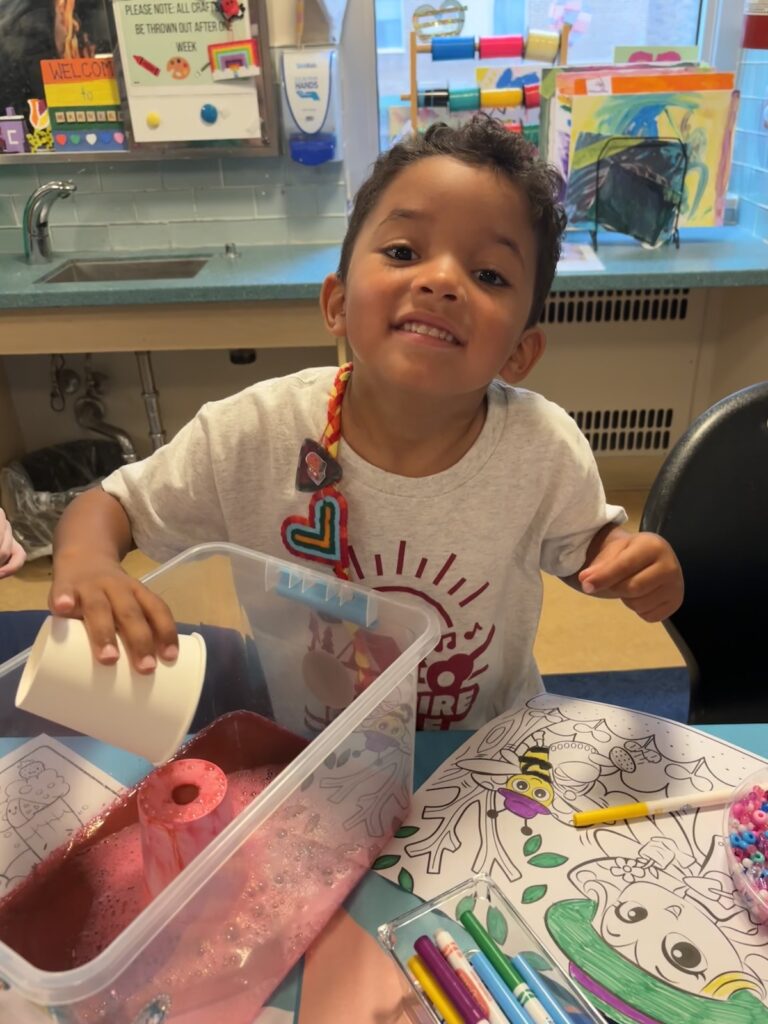 carter doing arts & crafts at camp