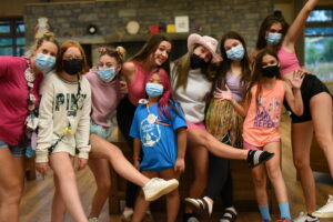 group of campers wearing masks in the dining hall at camp