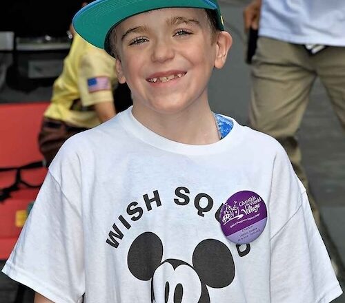 emerson wearing a micky mouse wish squad shirt