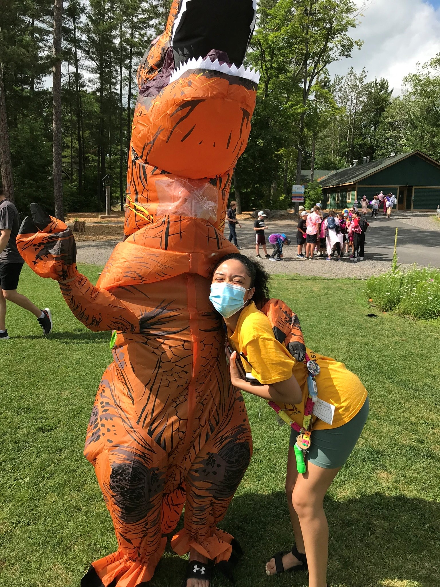 gabriella and person in dinosaur costume