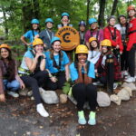 group of campers at adventure course at campfire circle muskoka