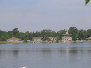 Lake with cabins in the distance