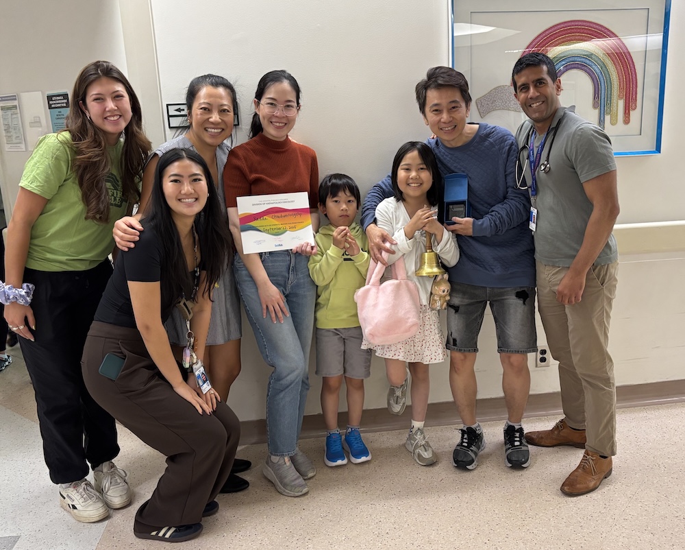 radda with family and staff in the hospital
