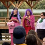 traci and volunteers in costume at campfire