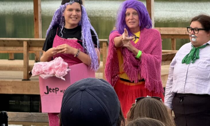 traci and volunteers in costume at campfire