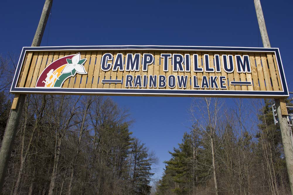 entrance sign at camp trillium rainbow lake