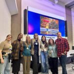 campfire circle staff and conference speakers in event space