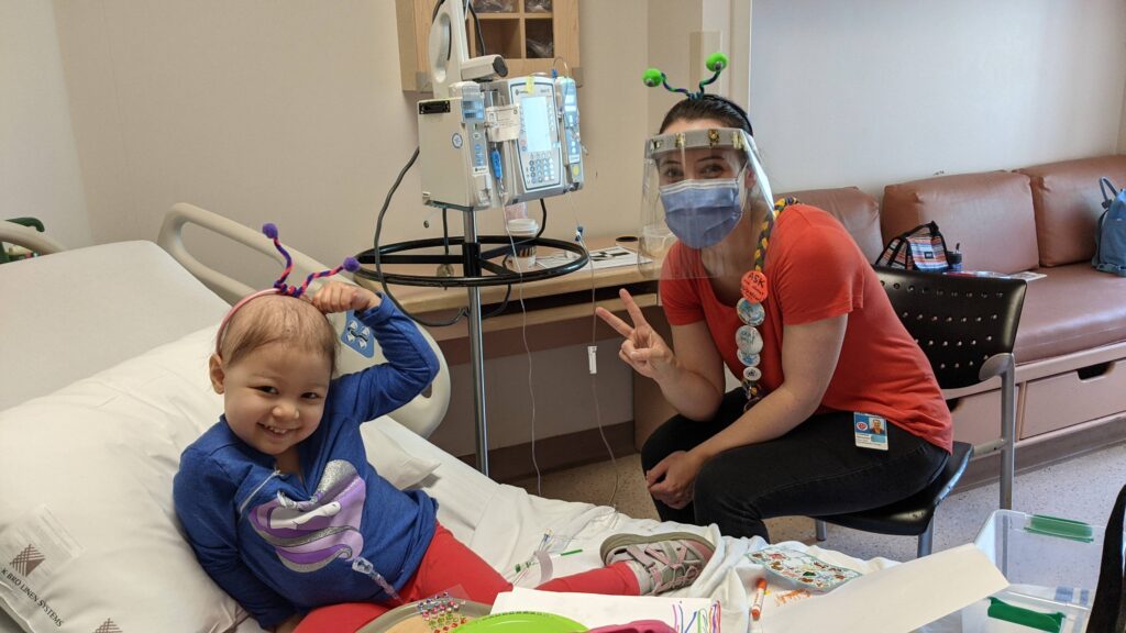 elliana with campfire circle staff in the hospital