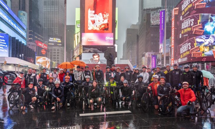 r2nyc riders and support team at times square in new york city