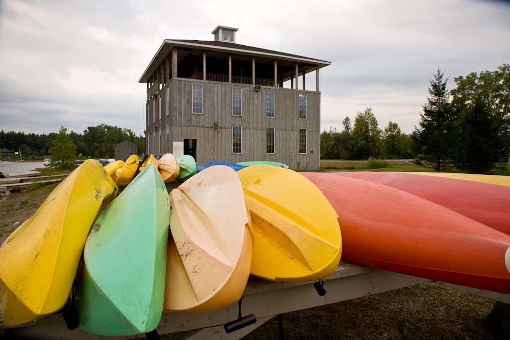 kayaks on a dock at camp trillium rainbow lake