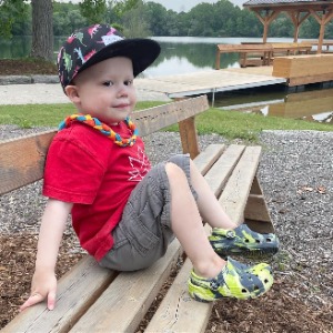ethan sitting on a park bench