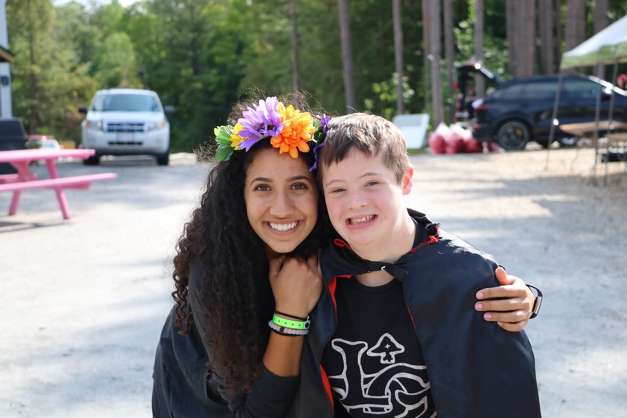 maram with camper outside at camp