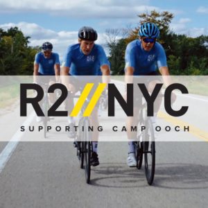 three men on racking bikes, wearing biking gear
